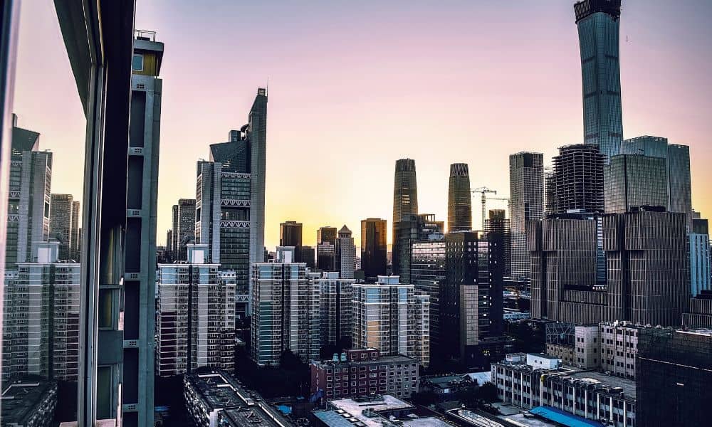 Aerial view of a downtown commercial district showing why a commercial property surveyor plays a key role in large property transactions