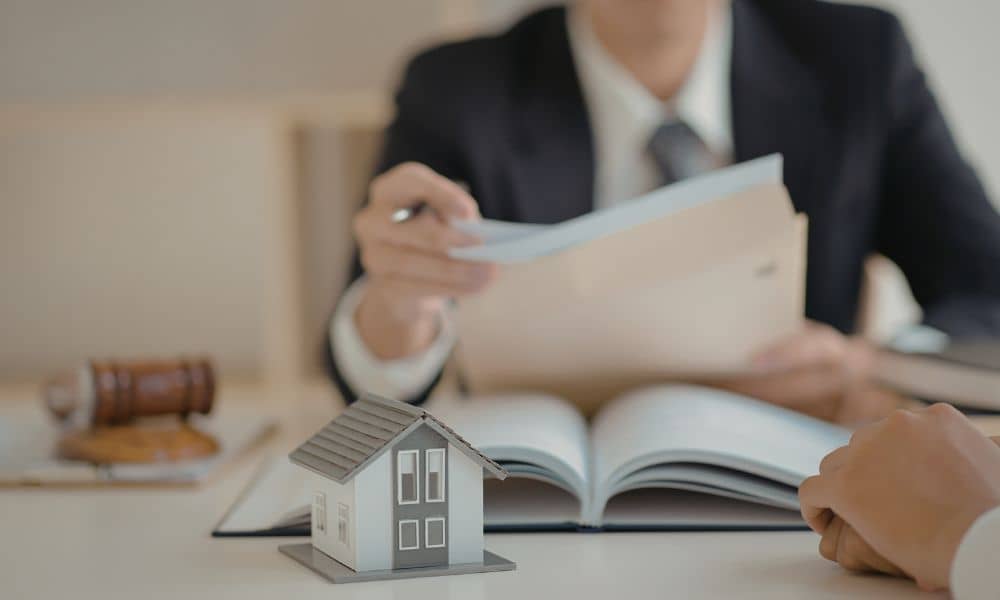 Homebuyers reviewing closing documents and noticing unexpected property survey costs during the home buying process