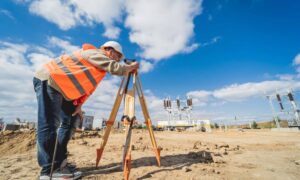Land survey field work - ALTA SURVEY Tampa Commercial property surveyor checking land conditions before development