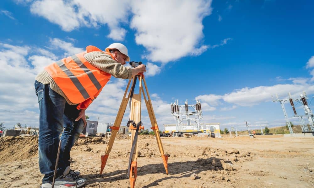 Commercial property surveyor checking land conditions before development